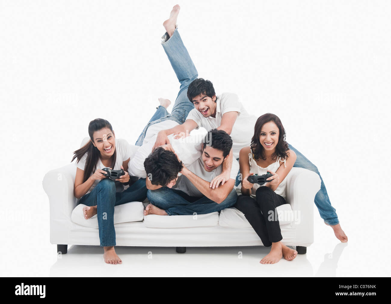 Friends playing video game Stock Photo - Alamy