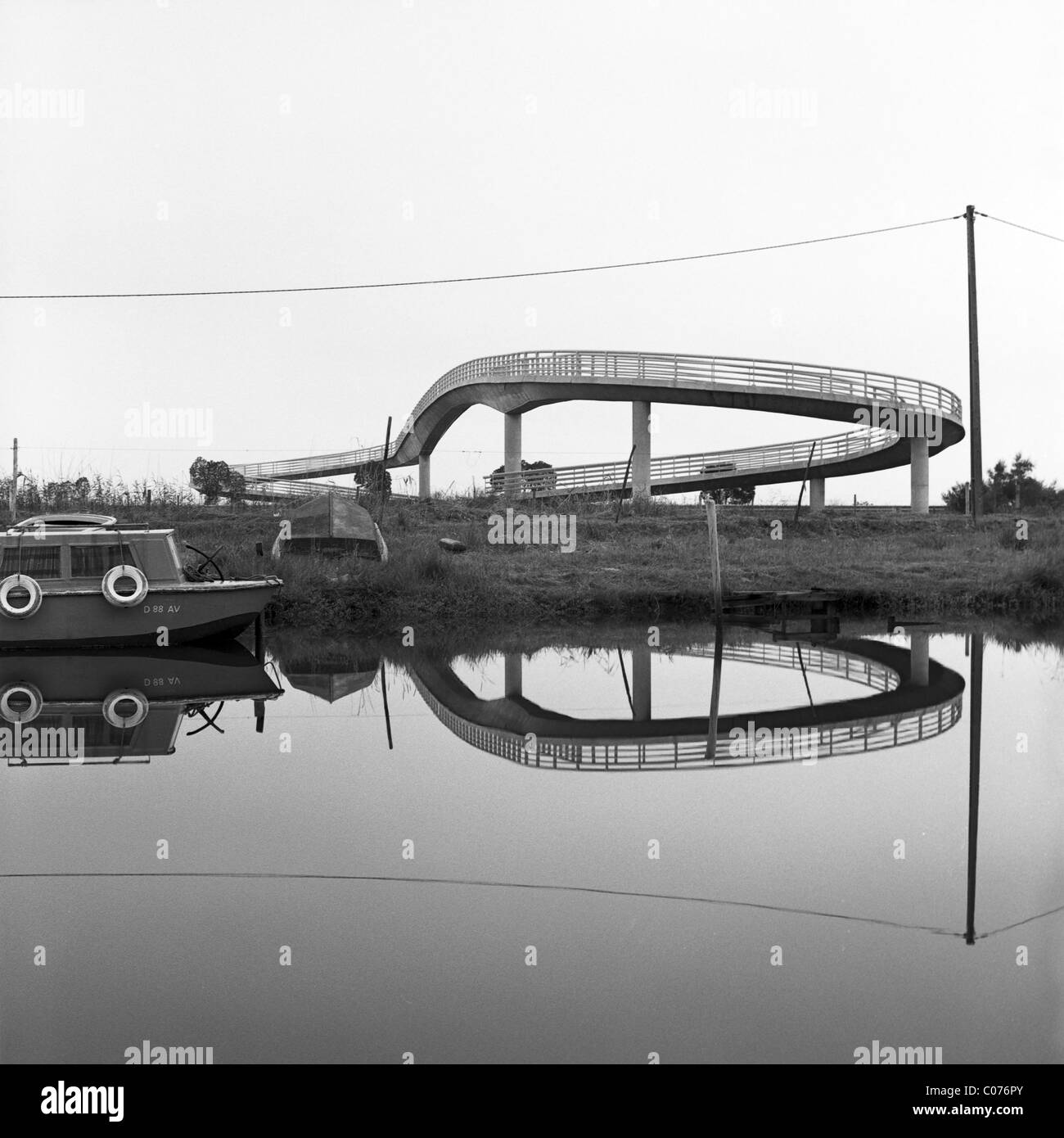 Standing body of water with reflection of a pedestrian bridge, Portugal