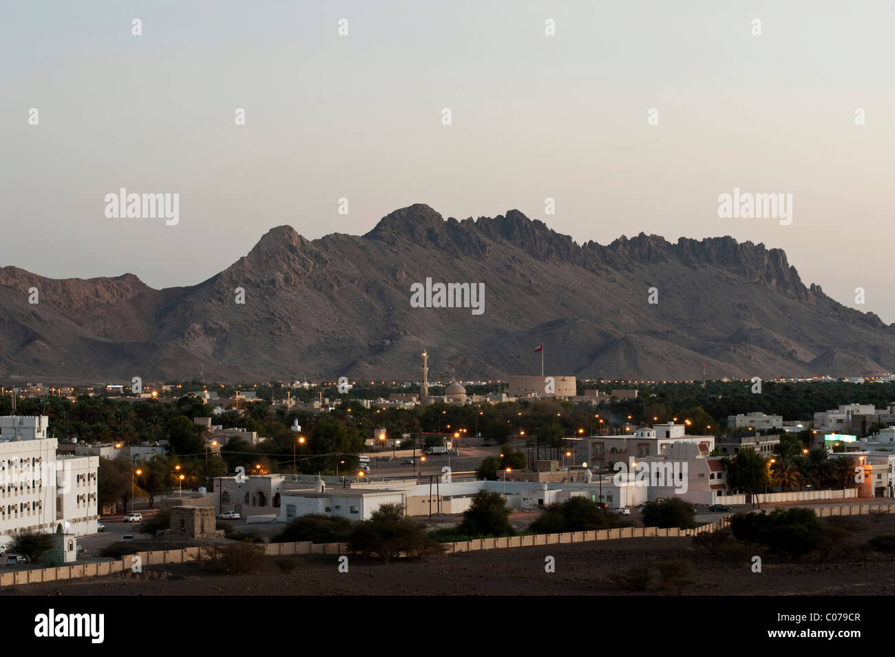 View of Nizwa in the evening twilight, Oman, Middle East Stock Photo