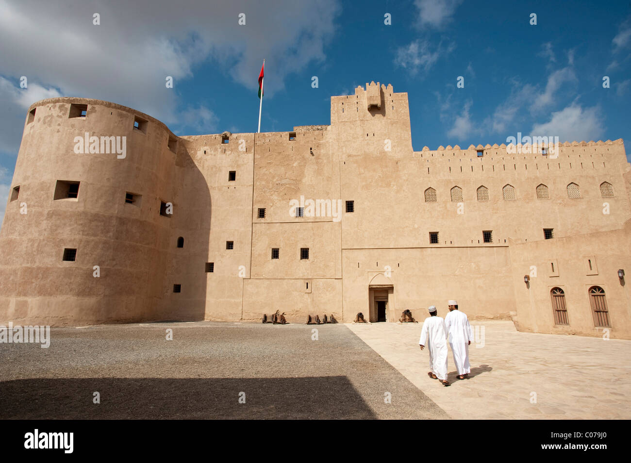 Fort Jabrin with two Omani visitors, Oman, Middle East Stock Photo