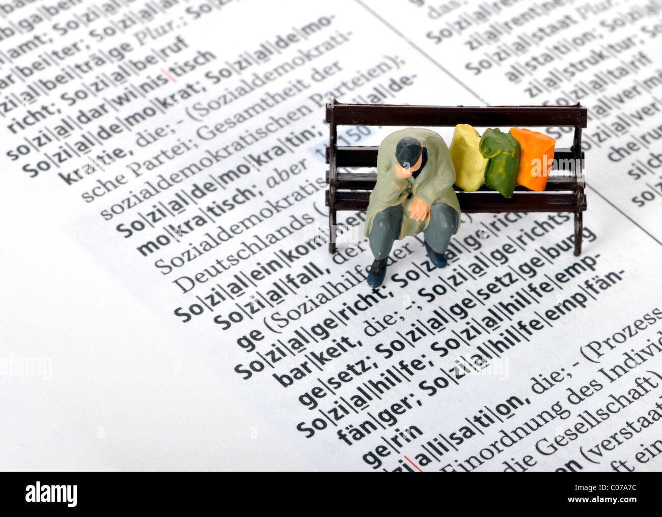 Figure, homeless, park bench, dictionary entry, symbolic image for