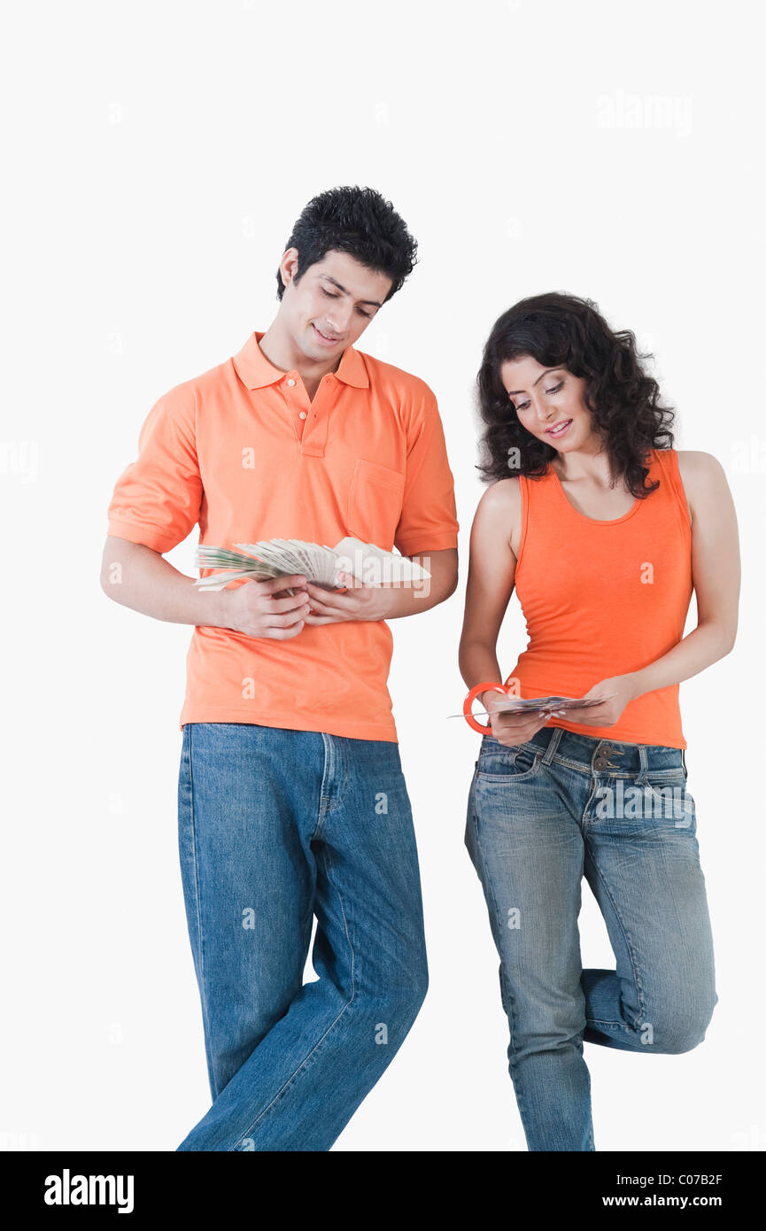 Couple choosing color from color swatches for their house Stock Photo
