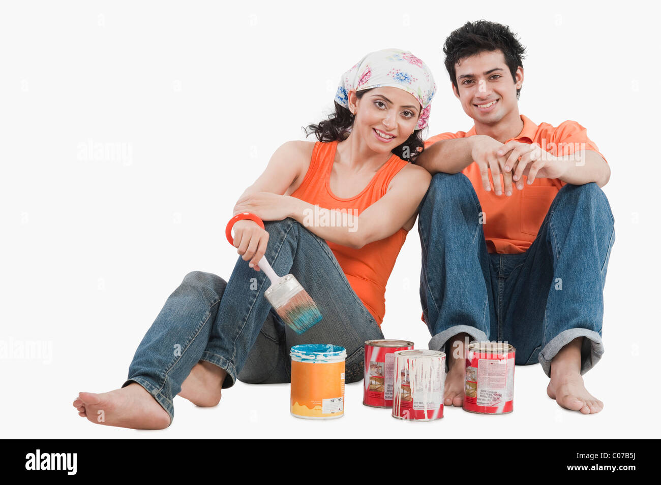 Couple with paint cans Stock Photo