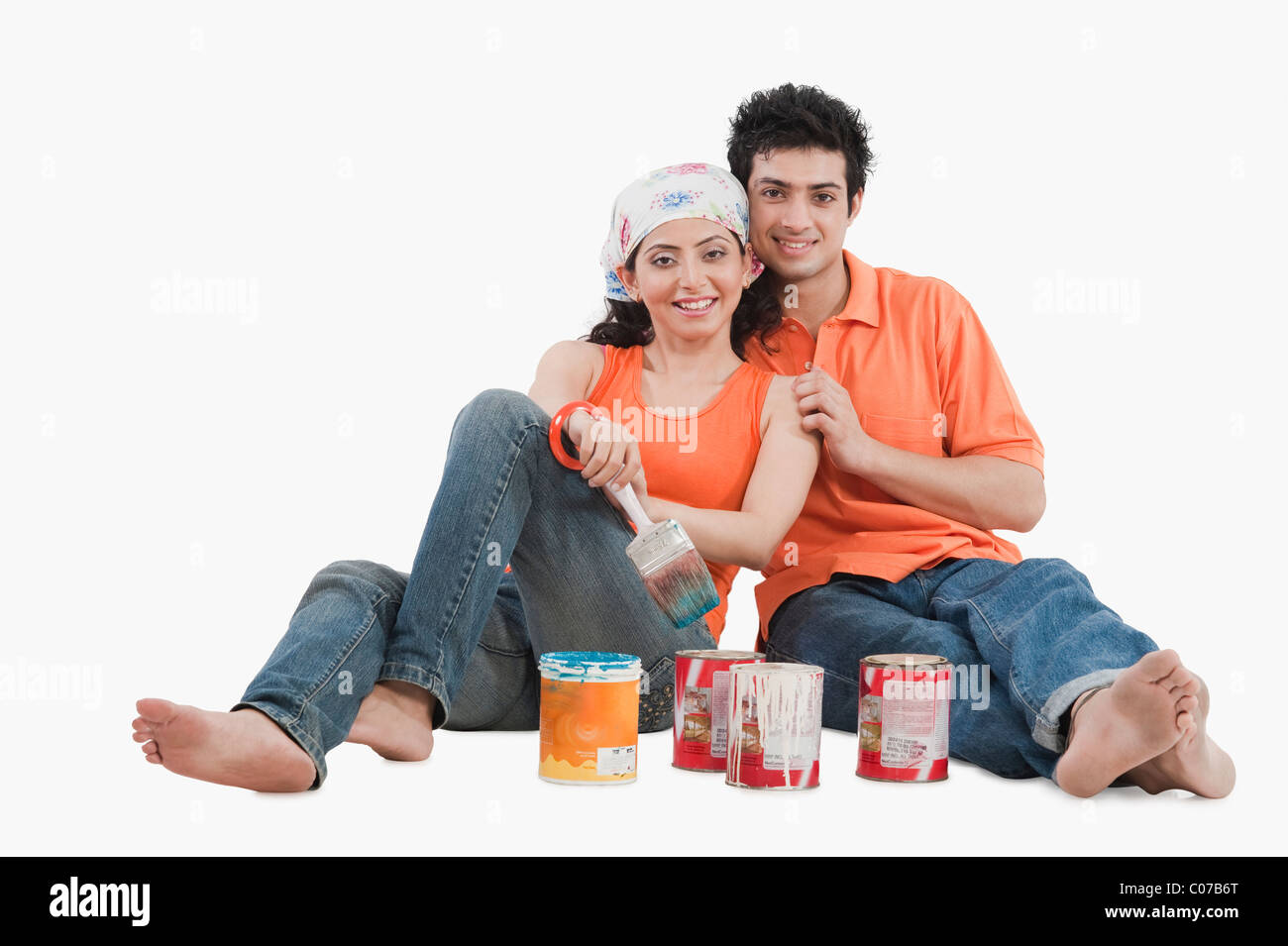 Couple with paint cans Stock Photo