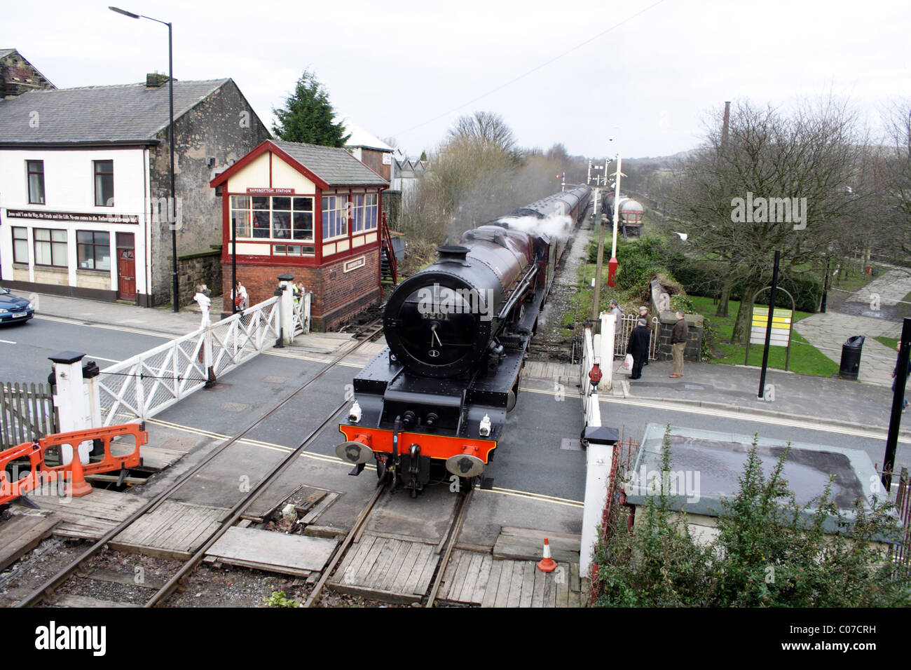 Steam locomotive 6201, negotiates the level crossing at Ramsbottom, UK Stock Photo