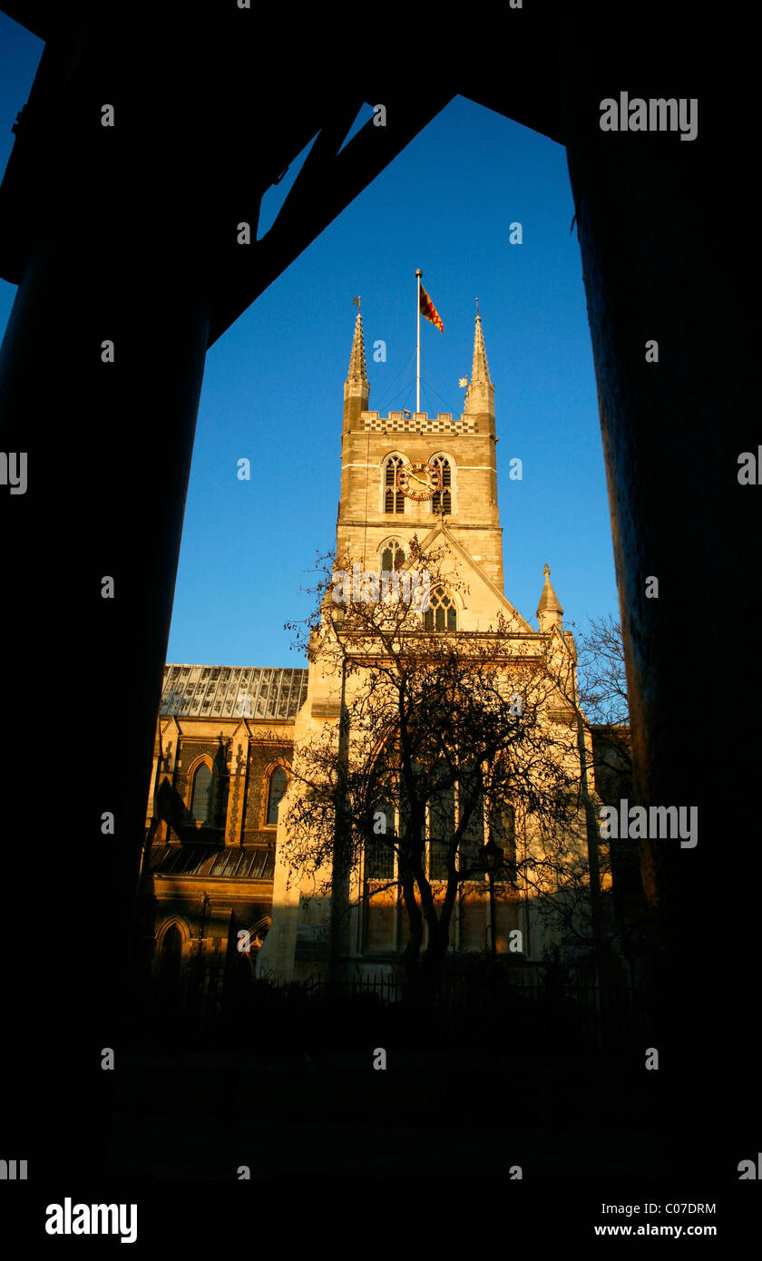 Southwark Cathedral seen from under the arches of Borough Market, Southwark, London, UK Stock Photo