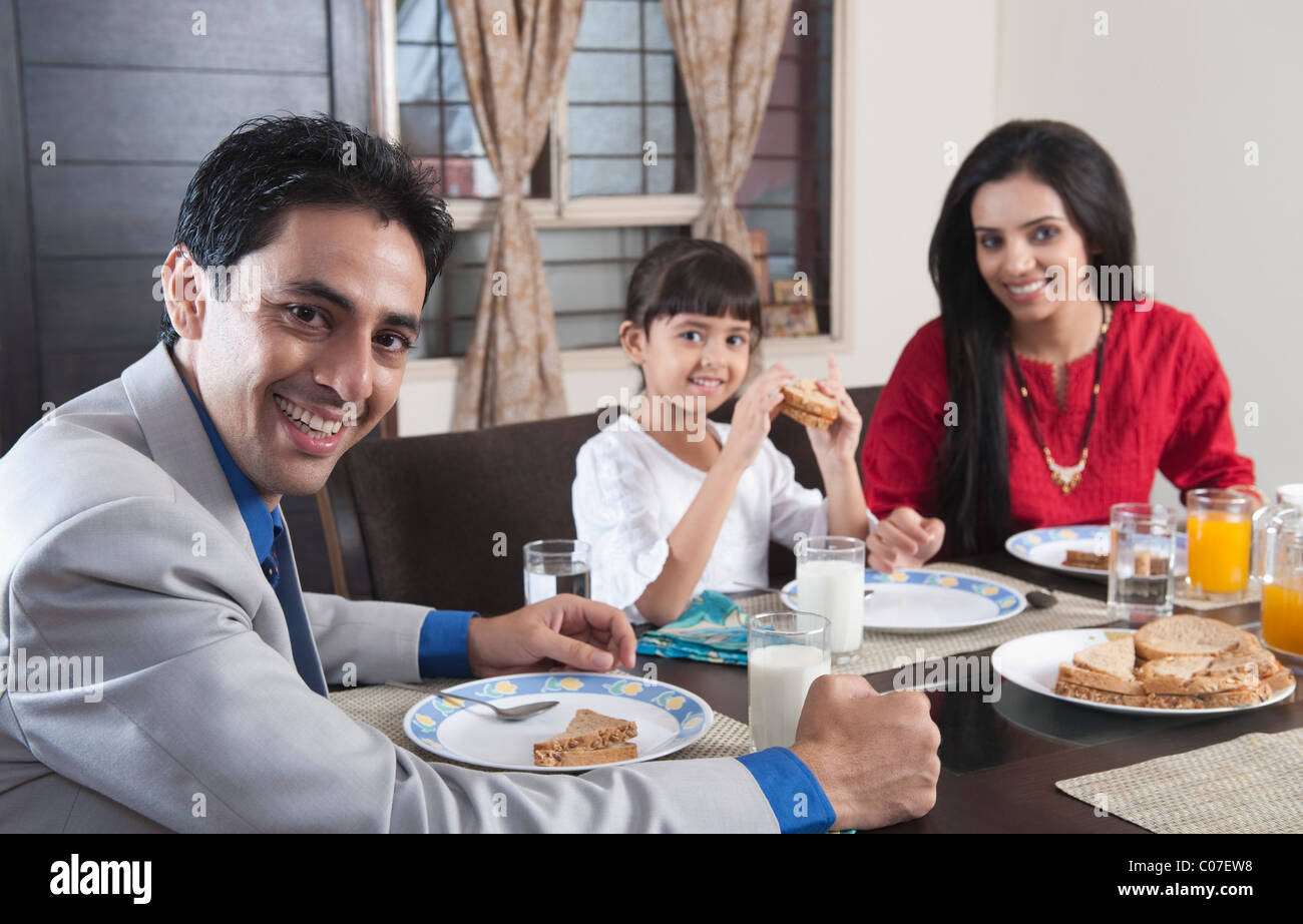 Family at a breakfast table Stock Photo - Alamy