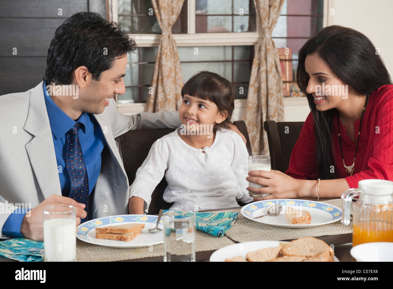 Family at a breakfast table Stock Photo - Alamy