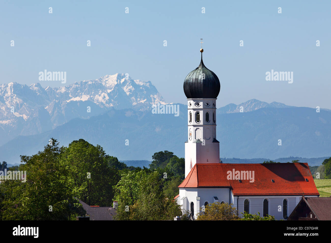 Church in Muensing, in the back Mt. Zugspitze, Fuenfseenland or Five Lakes region, Upper Bavaria, Bavaria, Germany, Europe Stock Photo