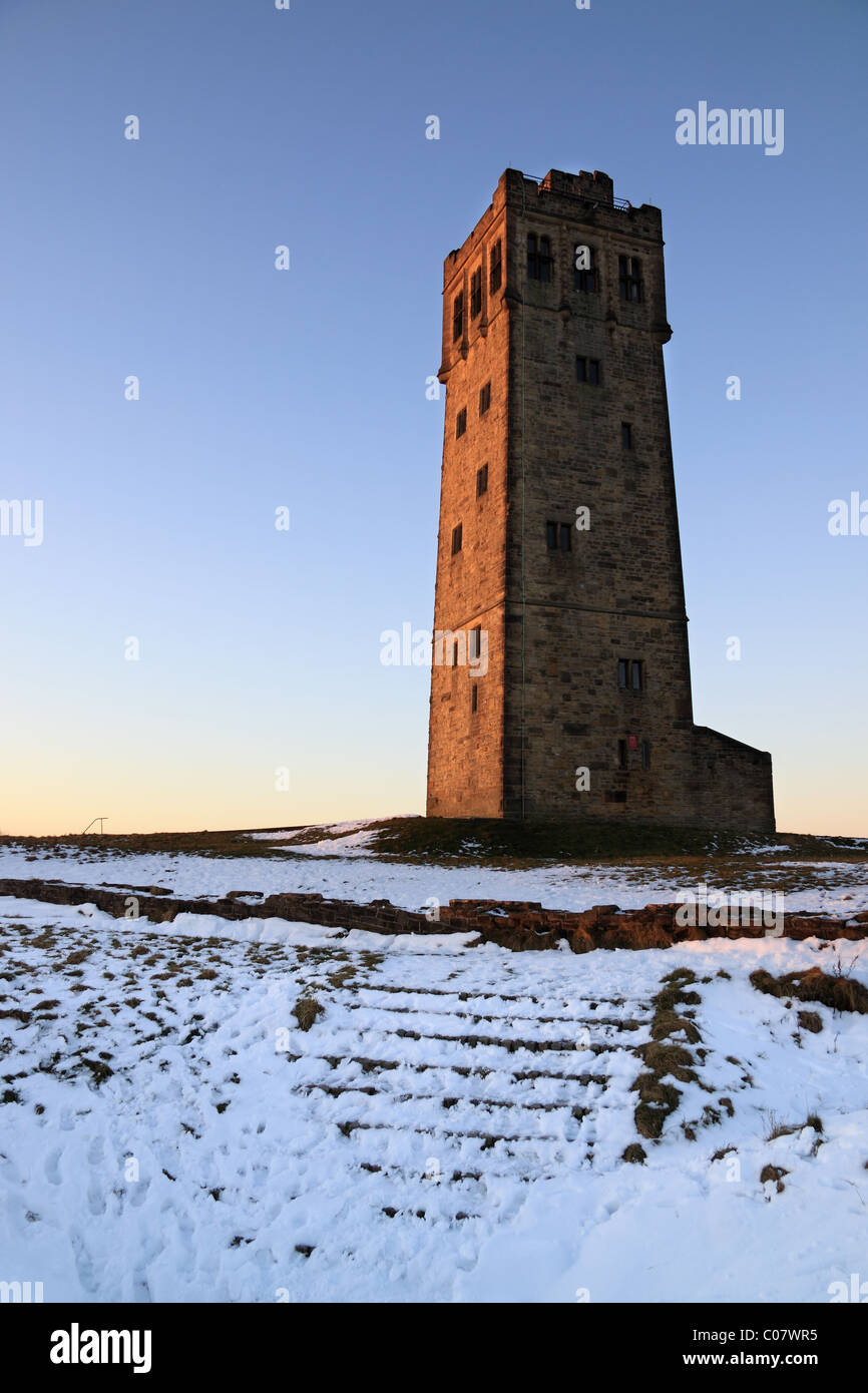 A snow covered wintertime view of the Jubilee Tower on Castle Hill, the well known landmark in Huddersfield, West Yorkshire Stock Photo