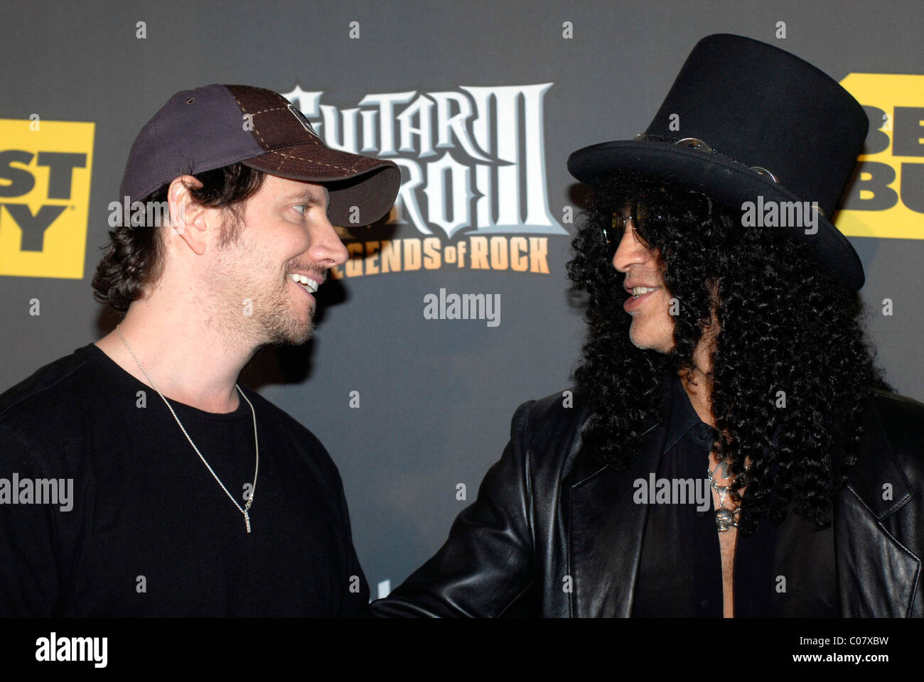 Jamie Kennedy and Slash arrive at the Guitar Heroes 3: Legends Of Rock launch event at the Best Buy rooftop Los Angeles, Stock Photo