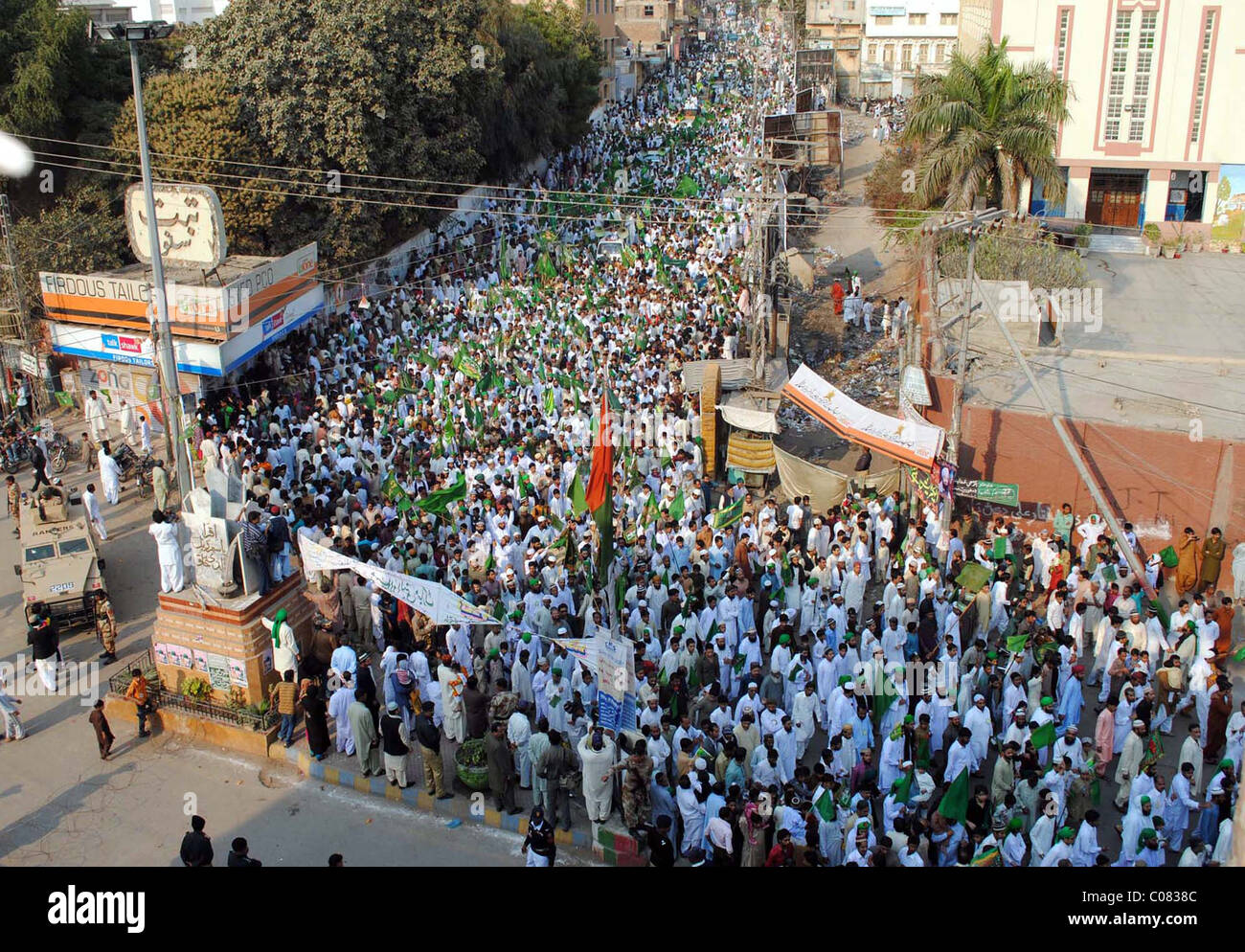 Participants of Eid-Milad-un-Nabi (SAW) rally pass through a road in ...