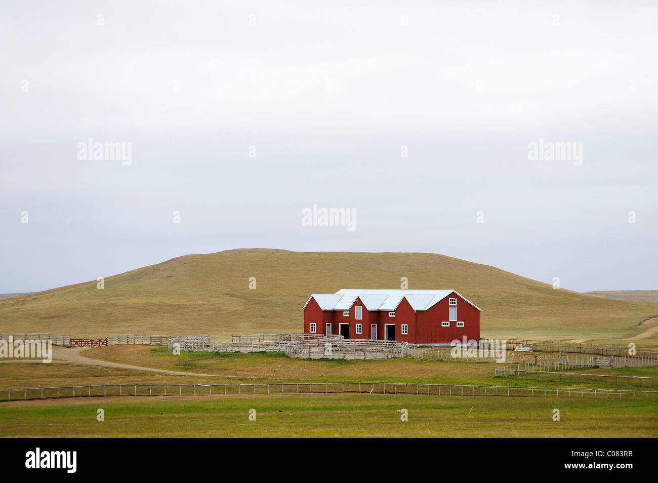 Red sheepshearers' shed in a hilly landscape, Ushuaia, Tierra del Fuego, Patagonia, Argentina, South America Stock Photo