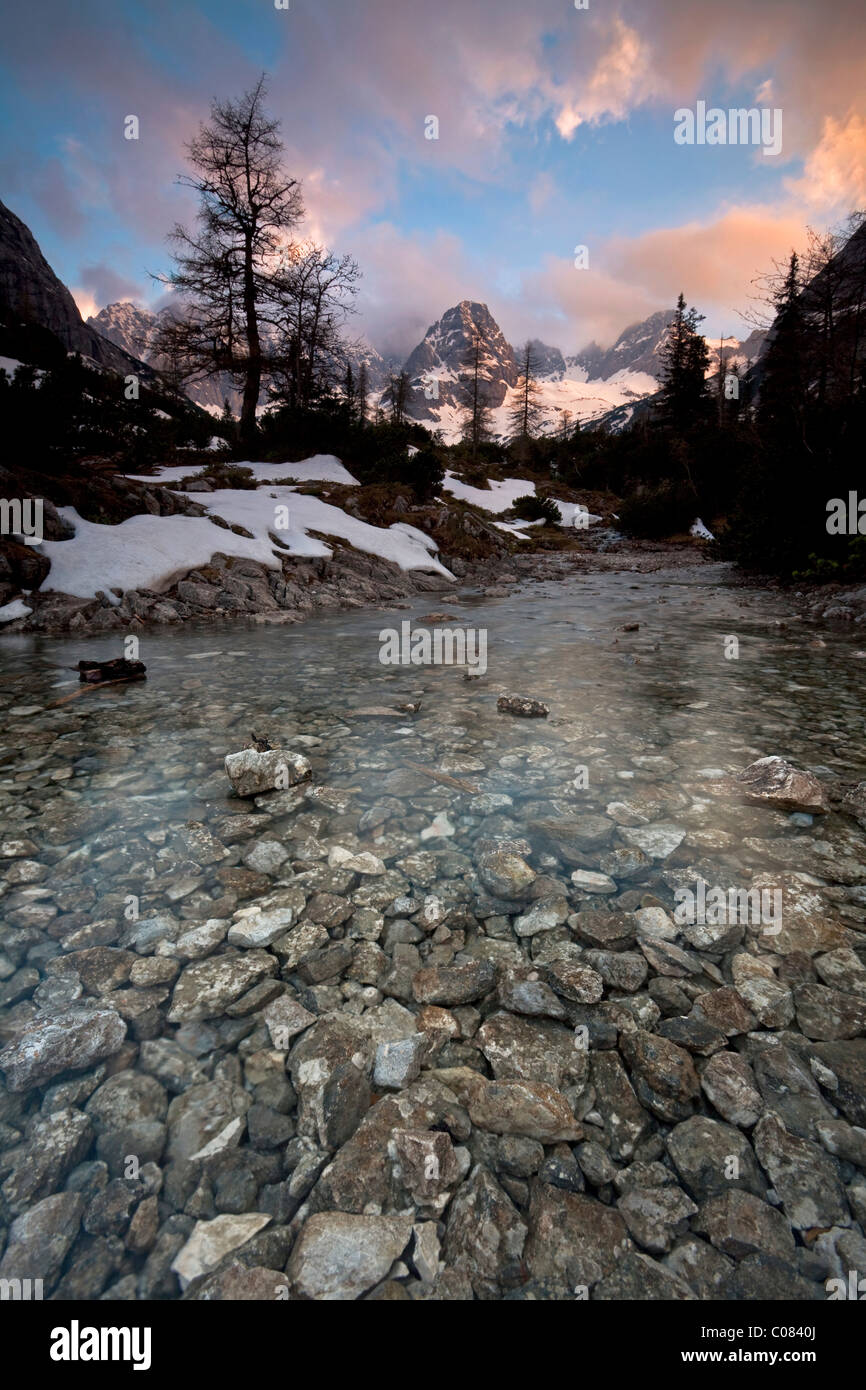 Mountain stream in the evening light below the Seebensee Lake in the Mieming Range near Ehrwald and Zugspitze Mountain, Tyrol Stock Photo