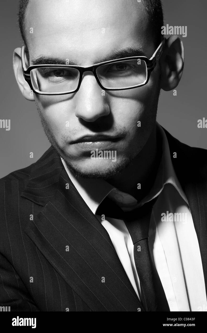 Portrait of a young man with glasses, suit, shirt and tie Stock Photo ...