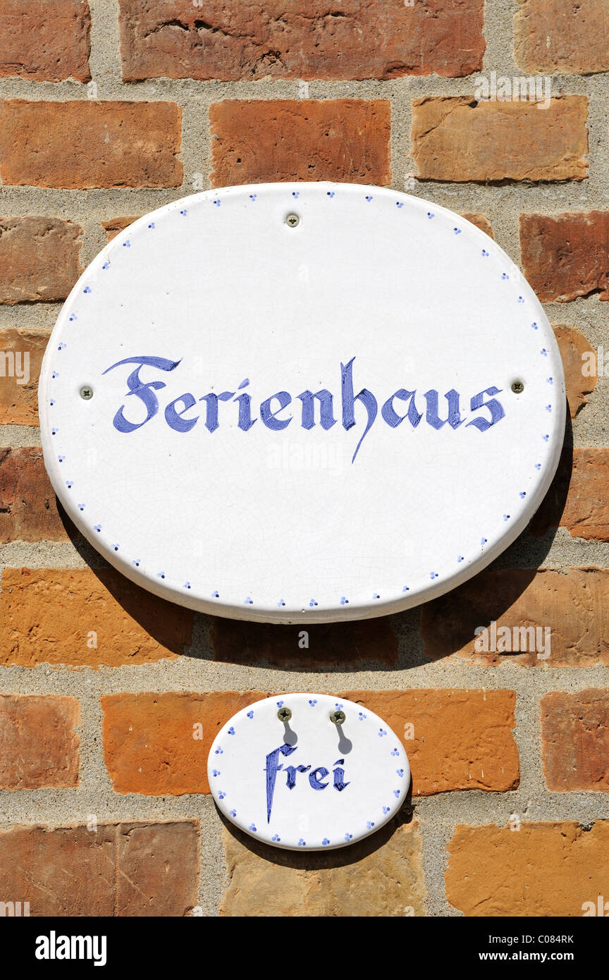 Signs on facade, Ferienhaus frei, German for holiday home, vacant, Germany, Europe Stock Photo