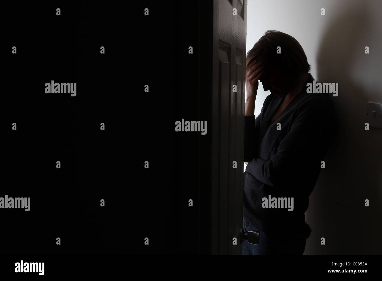 Silhouette standing head down on High Resolution Stock Photography and