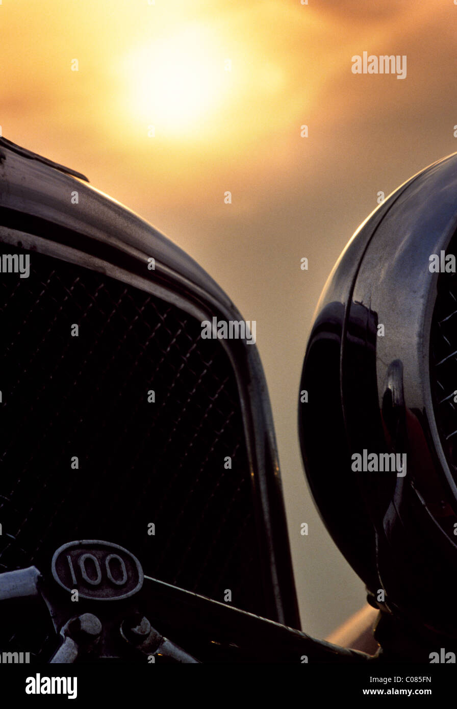 Jaguar SS 100 (1936-40) - lights and grill with sunset in background Stock Photo