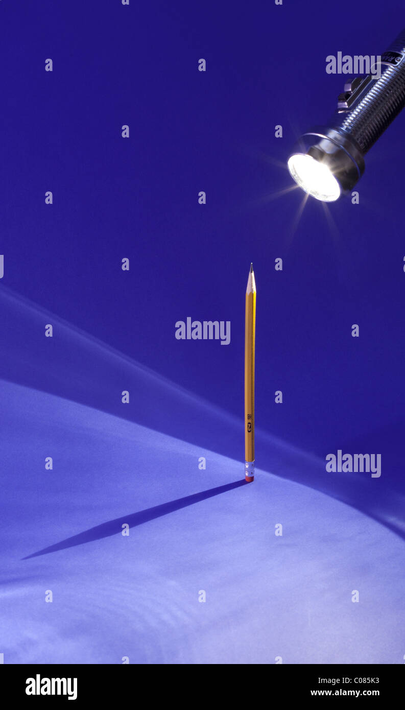 Shadow of a #2 pencil on a blue background Stock Photo