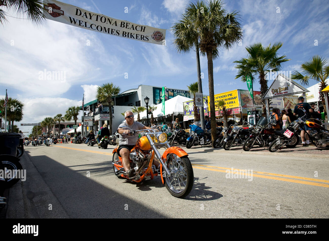 Custom Chopper riding up Main St Daytona.Bike week Stock Photo
