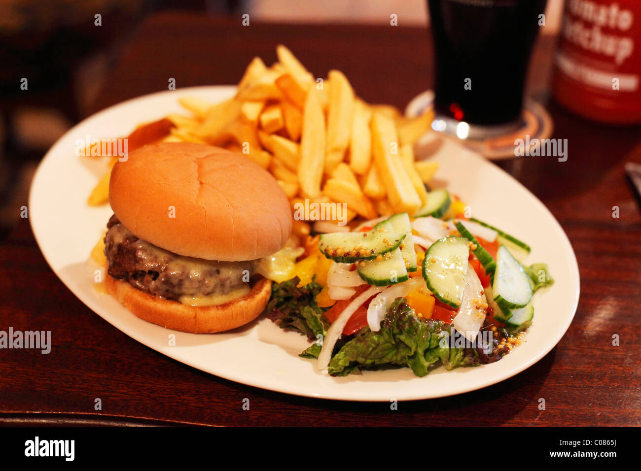 Cheeseburger with chips and salad, Ireland, British Isles, Europe Stock Photo