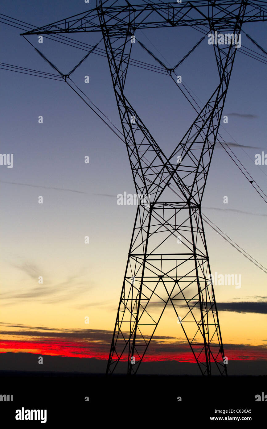 Electric transmission tower and sunset near Boise, Idaho, USA Stock