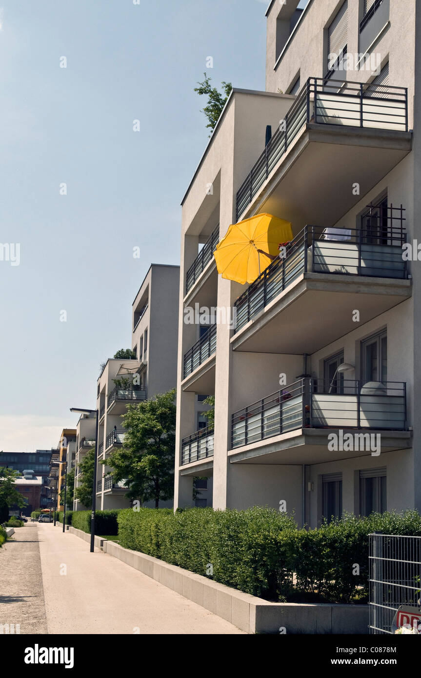 Modern residential houses, yellow parasol, Am Arnulfpark district housing development, Munich, Bavaria, Germany, Europe Stock Photo