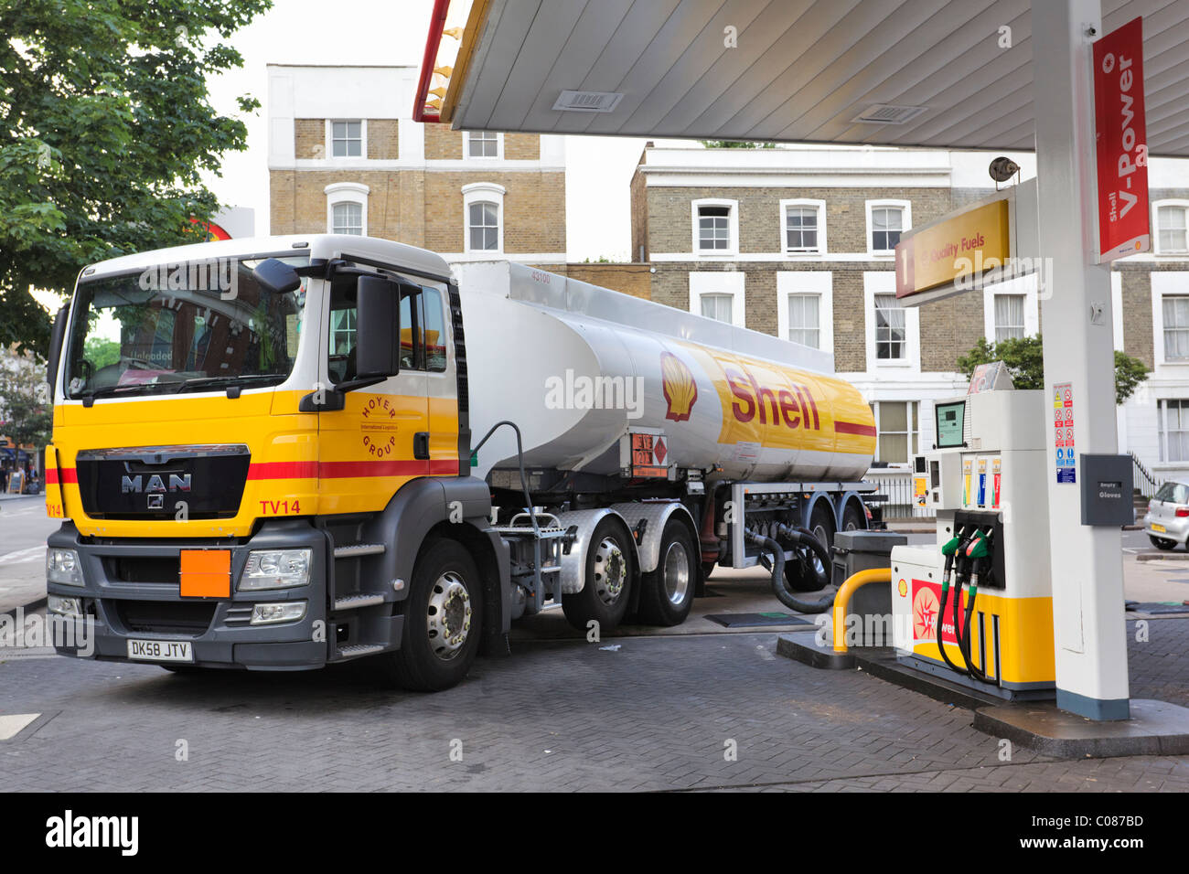 Tanker supplying Fuel station. Stock Photo
