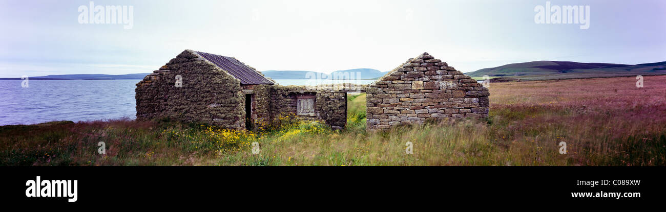 Derelict Barn or Cottage near Scapa Flow with the Hoy Hills in the background Stock Photo