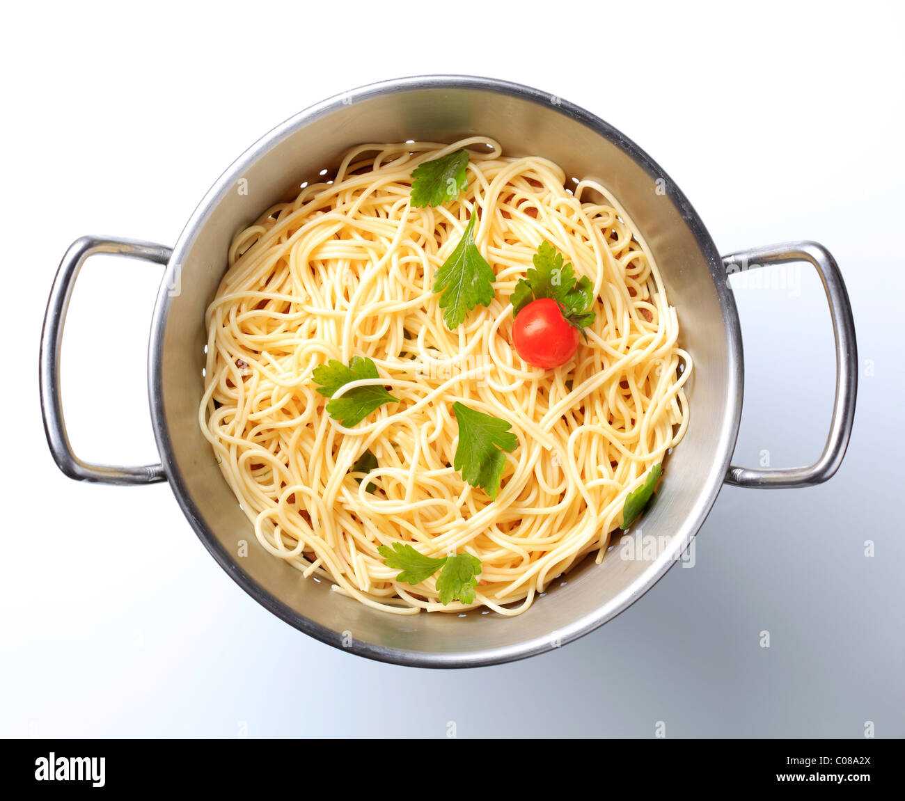 Cooked spaghetti in a colander - overhead Stock Photo
