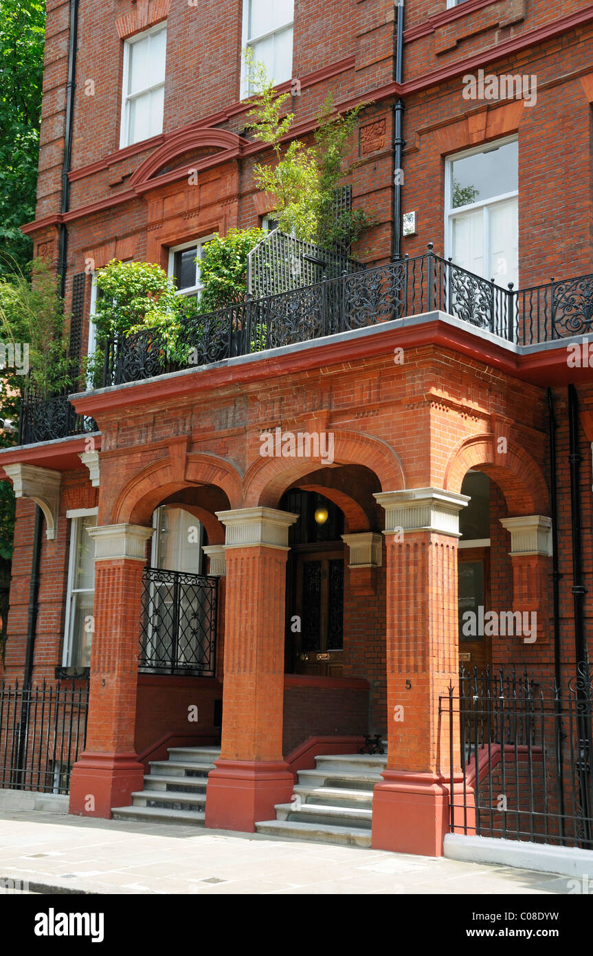 Red brick porticoes on terrace of grand houses Kensington and Chelsea SW3 London England UK Stock Photo