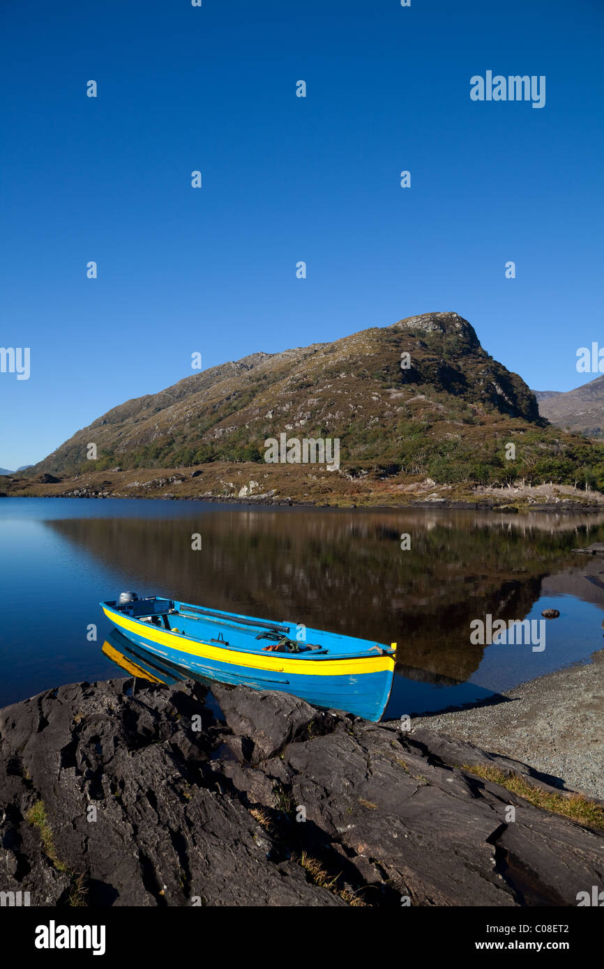 Eagle's Nest Mountain & Brightly Coloured Rowing Boat, The Long Range, Killarney National Park, County Kerry, Ireland Stock Photo