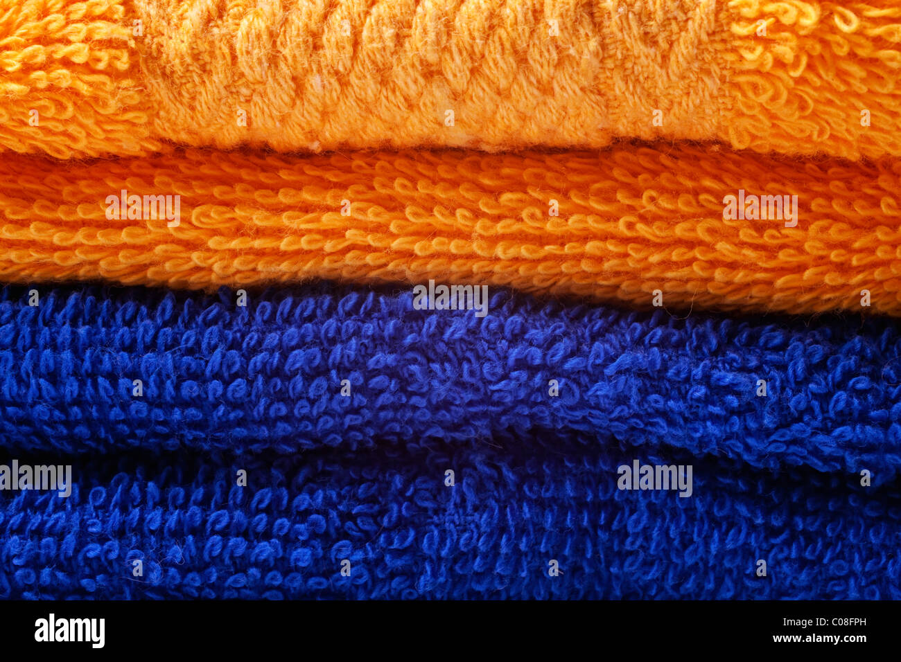 stack of bright colored cotton towels closeup Stock Photo Alamy