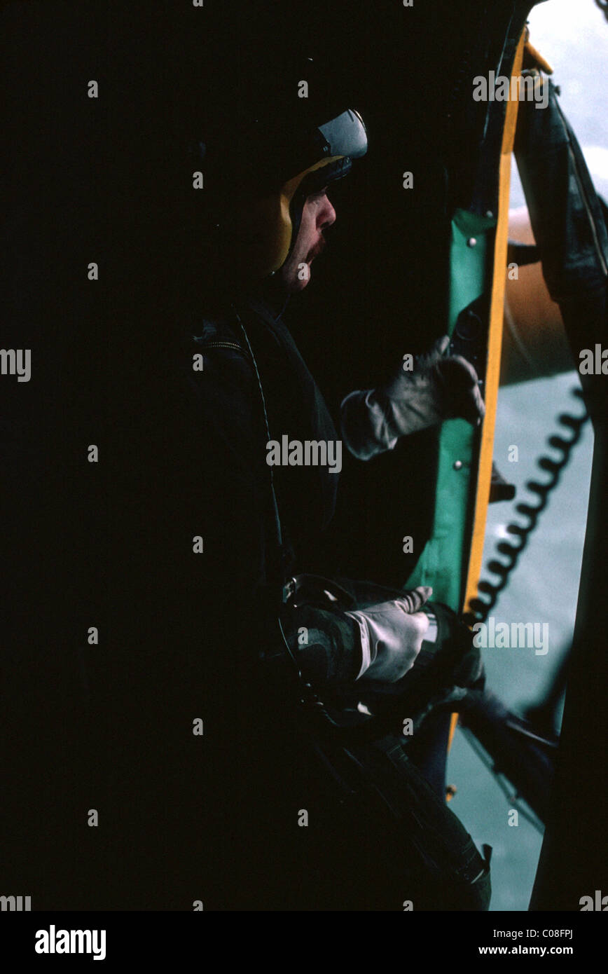 Helicopter crewman winching up casualty Stock Photo