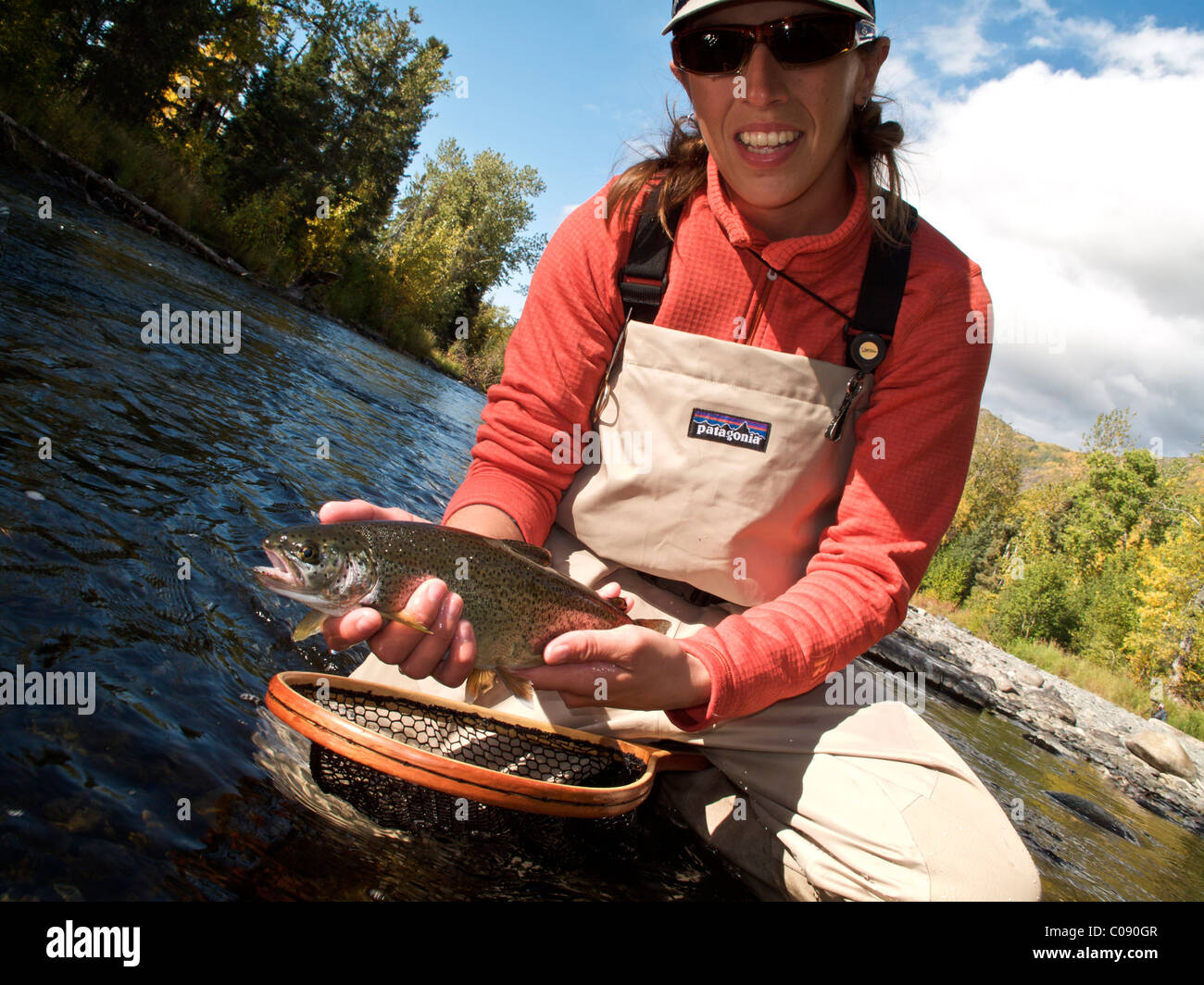 Woman holds and shows off a Rainbow Trout caught while fly fishing on the  Russian River, Kenai Peninsula, Southcentral Alaska Stock Photo - Alamy