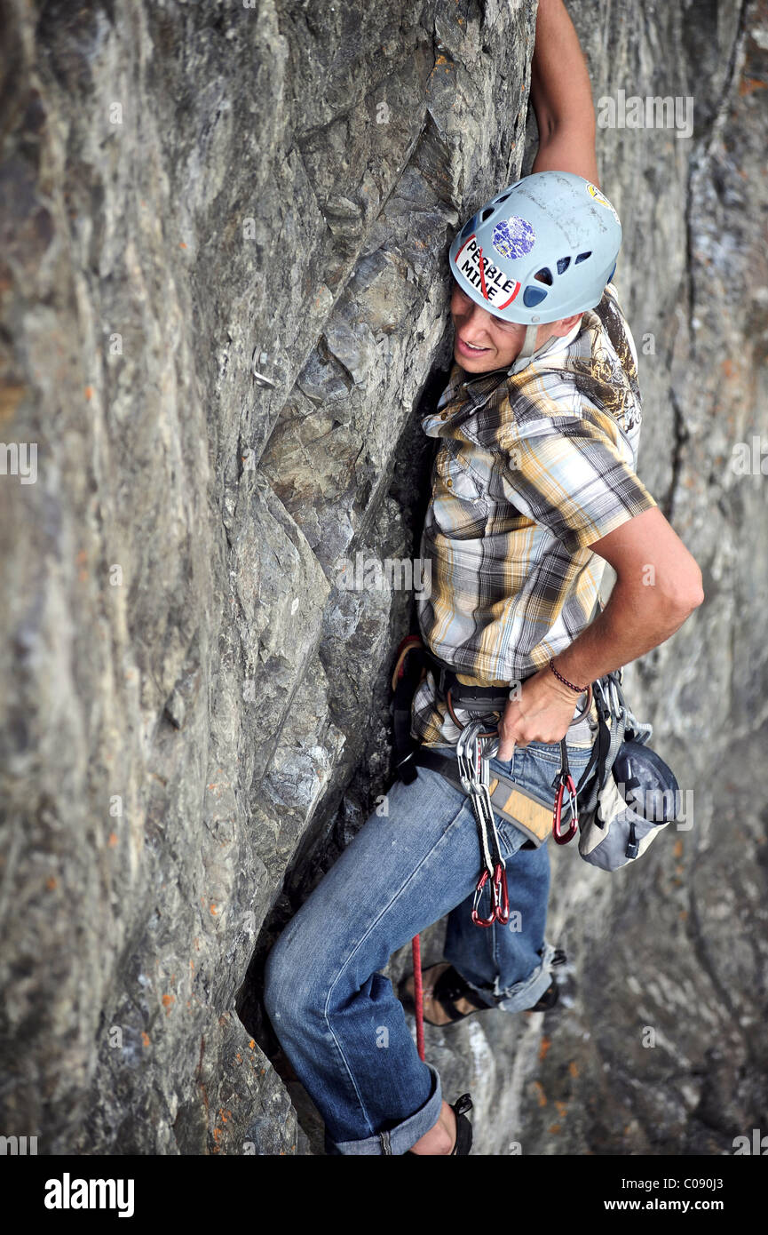 Man rock climbing along Turnagain Arm near Anchorage, Southcentral Alaska, Summer Stock Photo