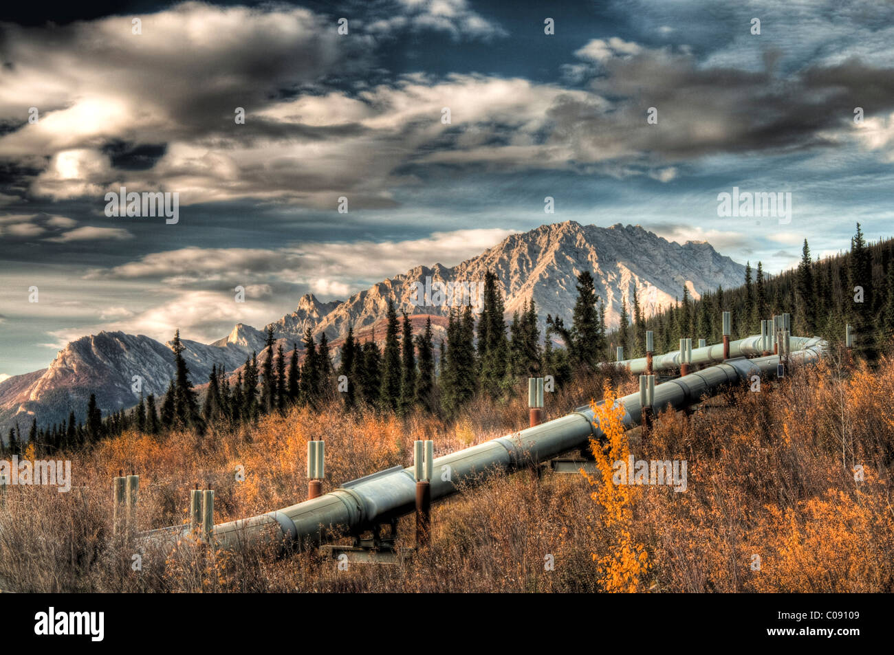 View of the Trans Alaska Pipeline winding next to Dalton Highway into the Brooks Range north of Sukapak Mountain, Alaska, HDR Stock Photo