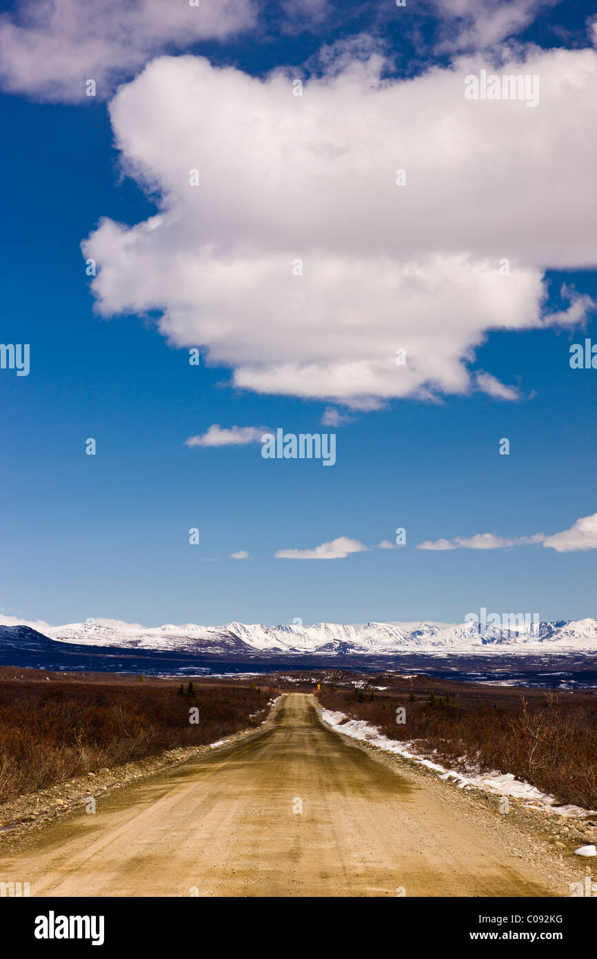View of the Denali Highway and Alaska Range foothills just before the Susitna River Bridge, Southcentral Alaska, Spring Stock Photo