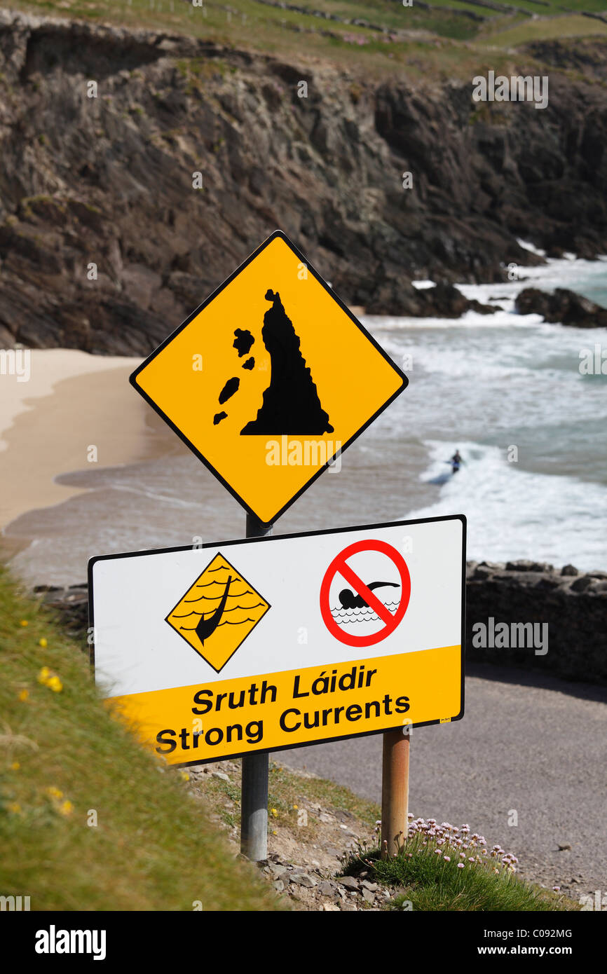 Warning signs in Gaelic and English, strong currents, swimming prohibited and rockfall, Slea Head, Dingle Peninsula, , Ireland Stock Photo