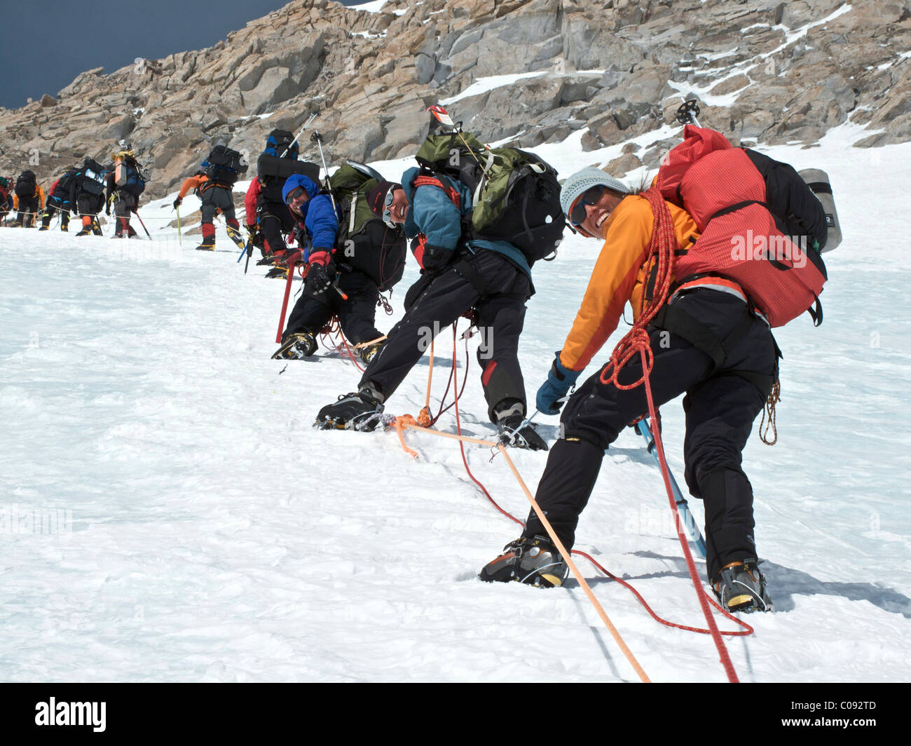 Group of climbers ascend the headwall on the West Buttress Route on Kahiltna Glacier, Denali National Park, Alaska Stock Photo