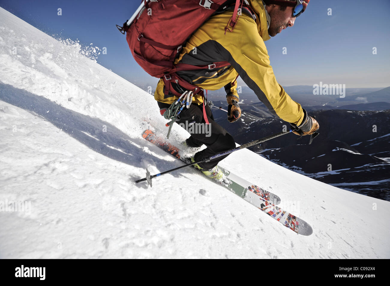 Backcountry skier makes an early morning descent of the north side of