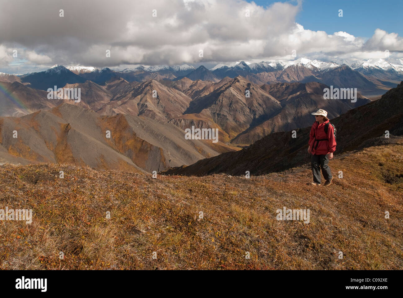 Scenic landscape of a hiker walking on an alpine ridge above Igloo ...