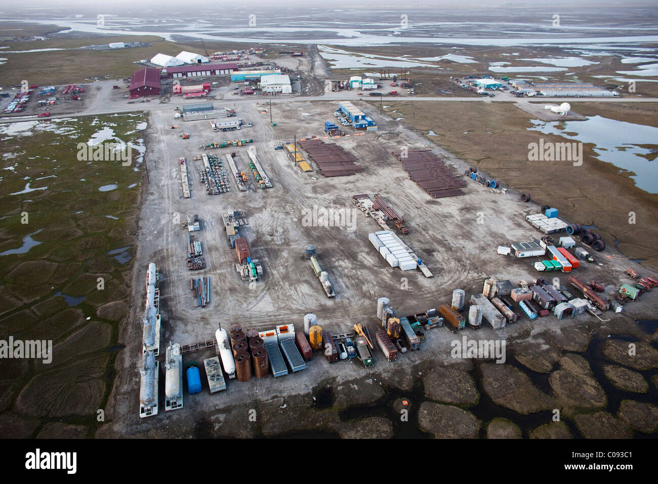 Aerial view of staged oil drilling supplies and equipment in the Prudhoe Bay oil field, Arctic Alaska, Summer Stock Photo