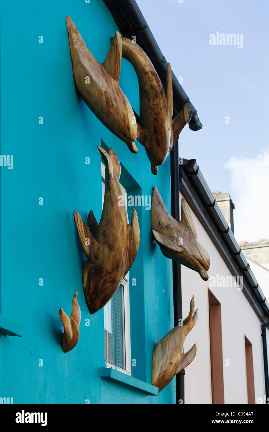 Dolphin sculptures on facade, Dingle, County Kerry, Ireland, British Isles, Europe Stock Photo