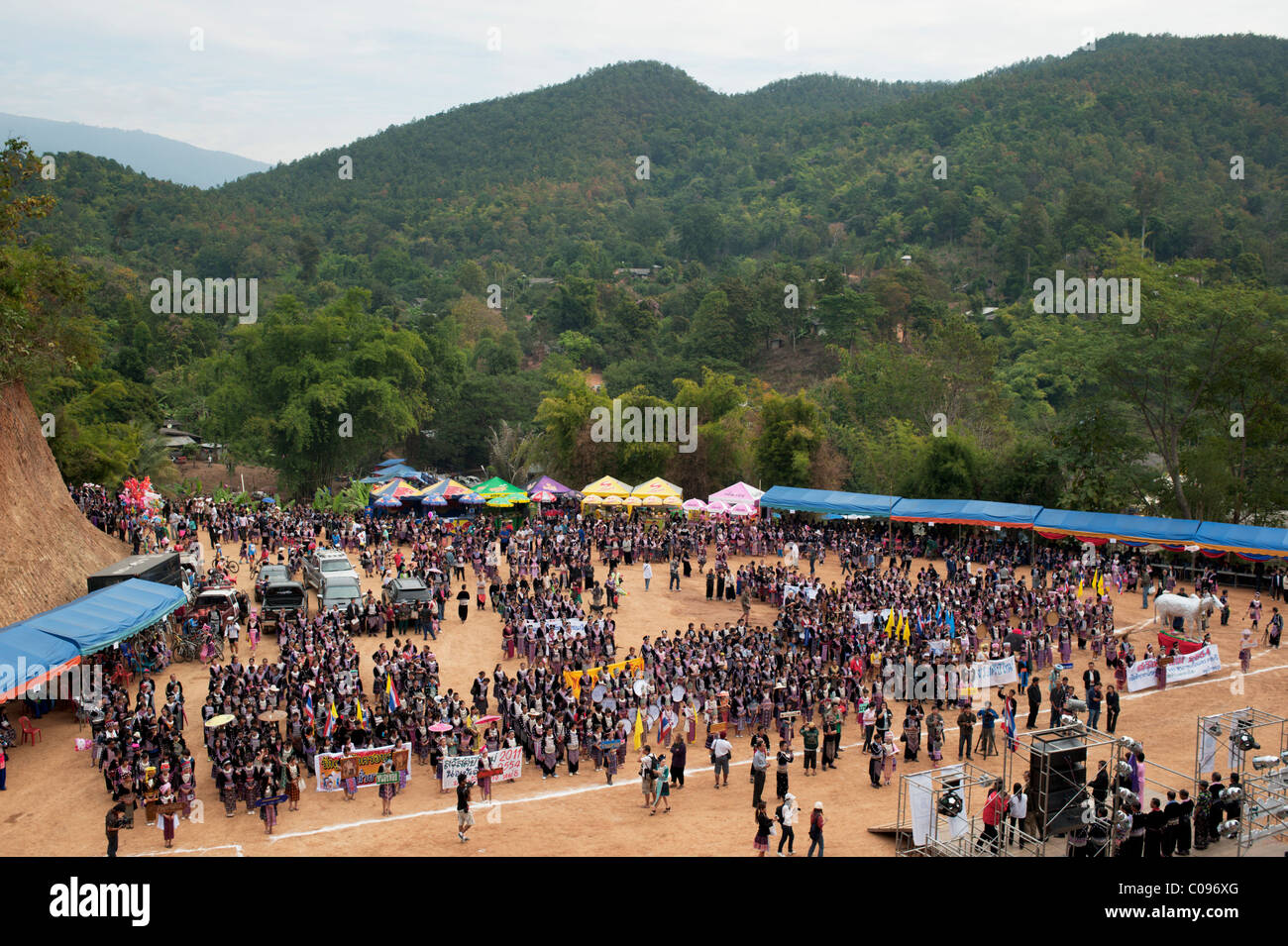 Hmong men and women take part in a new year festival parade at Hung Saew village, Chiang Mai, Thailand. Stock Photo