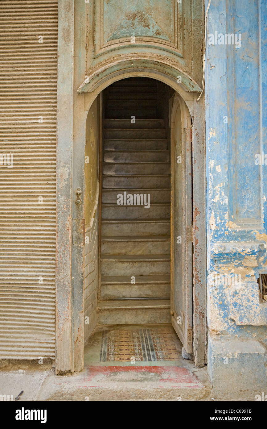 Old traditional door way and staircase to a house in a side street ...