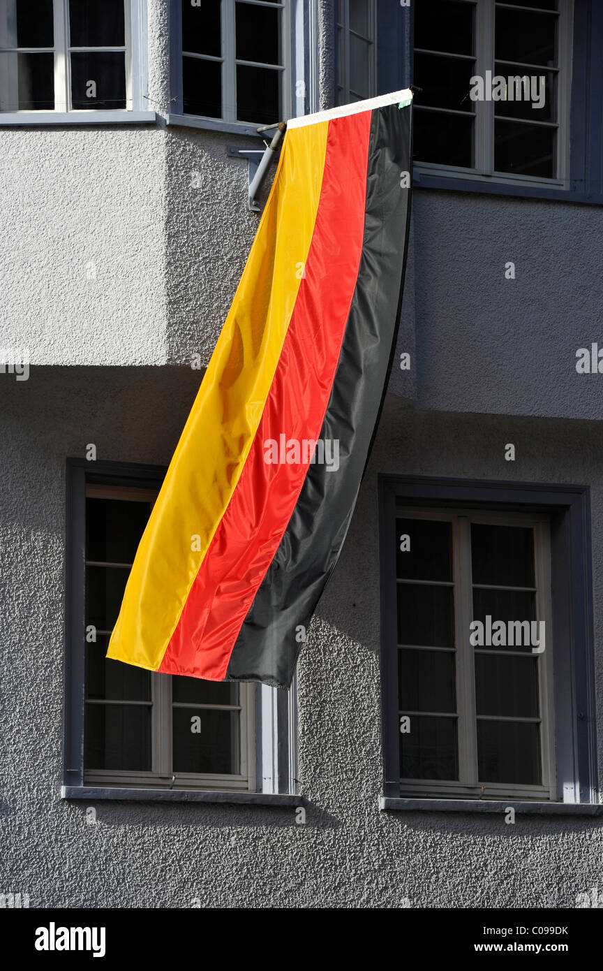 German flag hanging out of the window of a house during the 2010 FIFA World Cup Stock Photo