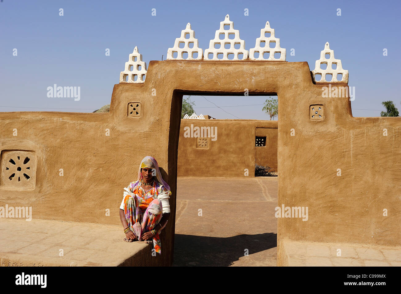 Young woman at the entrance to a courtyard, Thar Desert, Rajasthan, North India, India, Asia Stock Photo