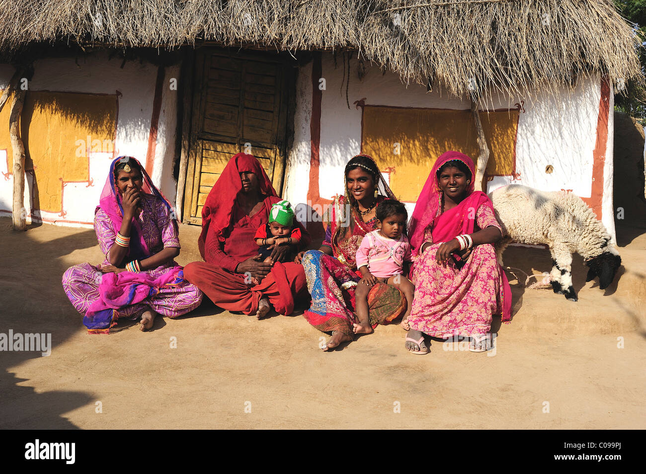 Women together in front of their house, Thar Desert, Rajasthan, North India, India, Asia Stock Photo