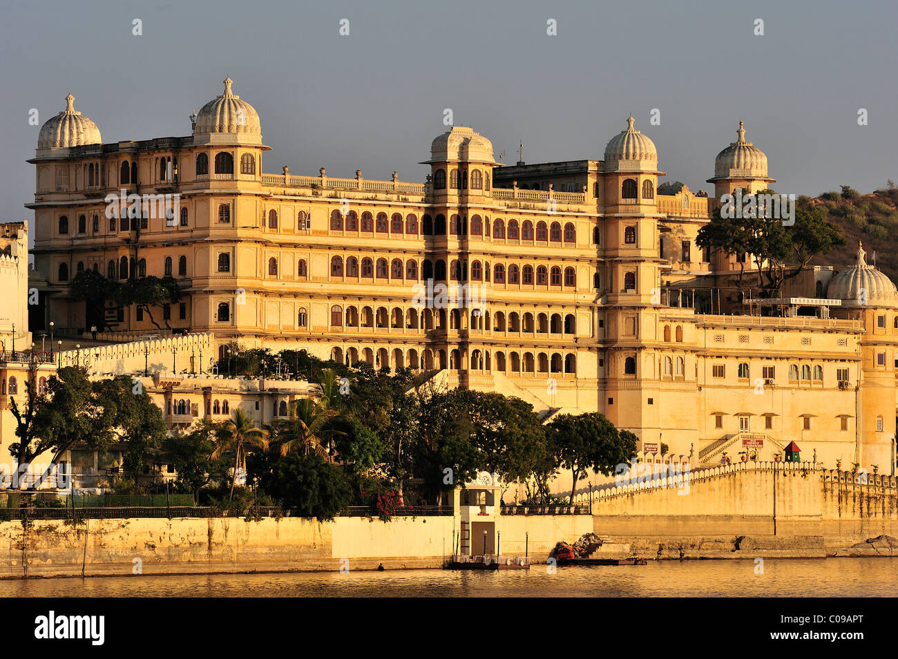 Partial view of the City Palace of Udaipur in the evening light, home of the Maharaja of Udaipur, a museum and a luxury hotel Stock Photo